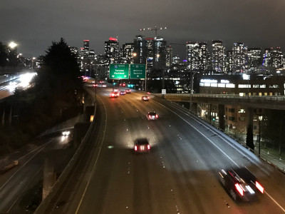 photograph of seattle skyline from an overpass at night